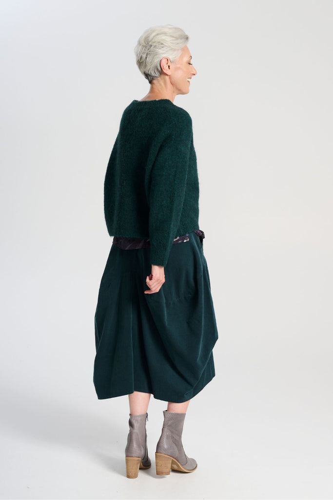 Olga de Polga Teal Milwaukee Marlowe cord skirt in 100% cotton. Comfy waistband making it the perfect throw-on-and-go! Side back view on model