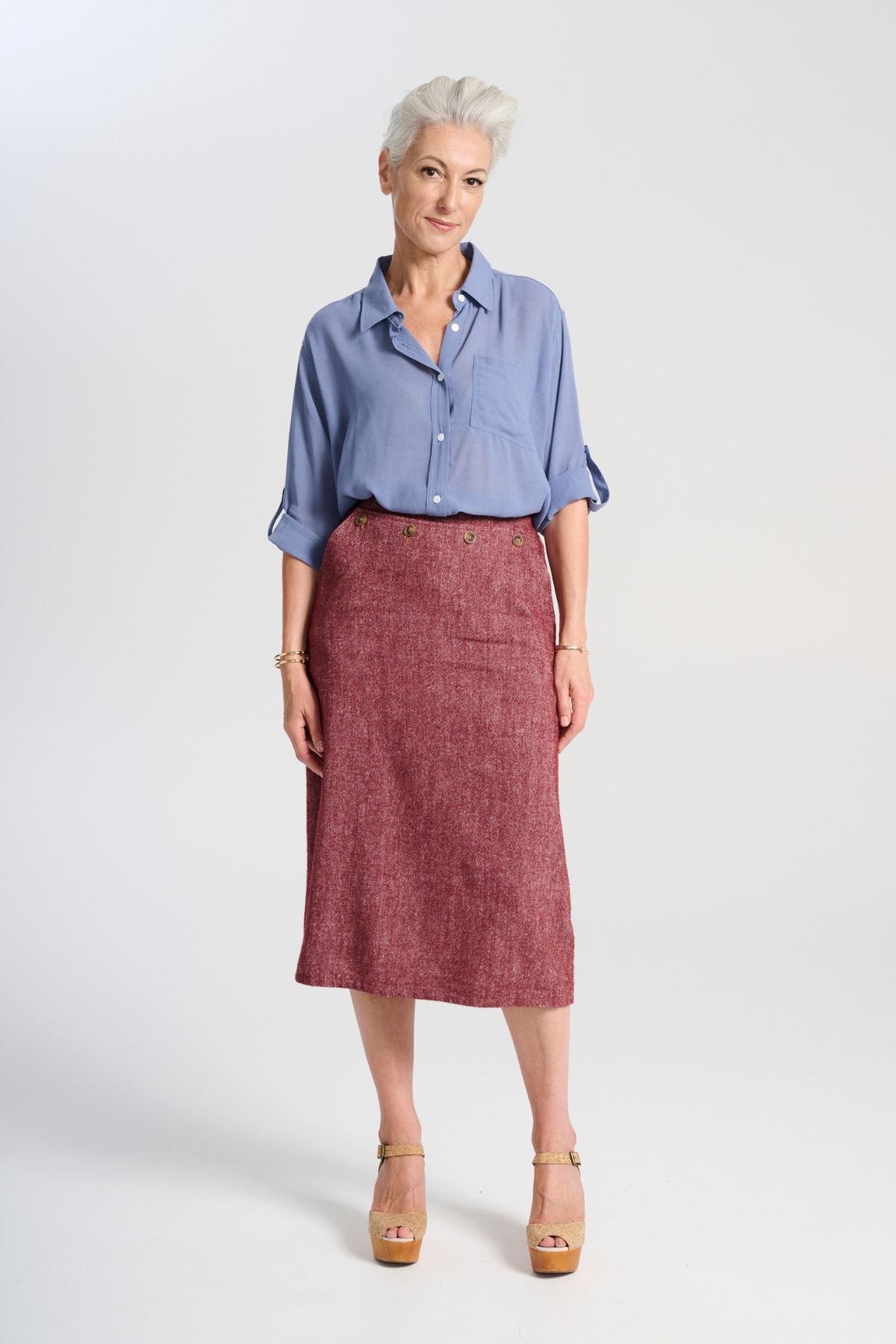 Olga de Polga Hepburn Haven skirt in Vino wool/linen. Unique front button feature, and has a back split. Finishes below the knee. Front full view on model.