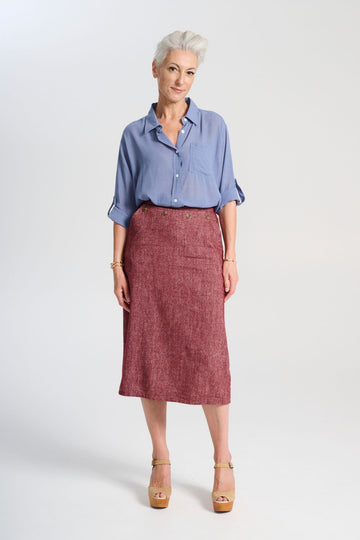 Olga de Polga Hepburn Haven skirt in Vino wool/linen. Unique front button feature, and has a back split. Finishes below the knee. Front full view on model.