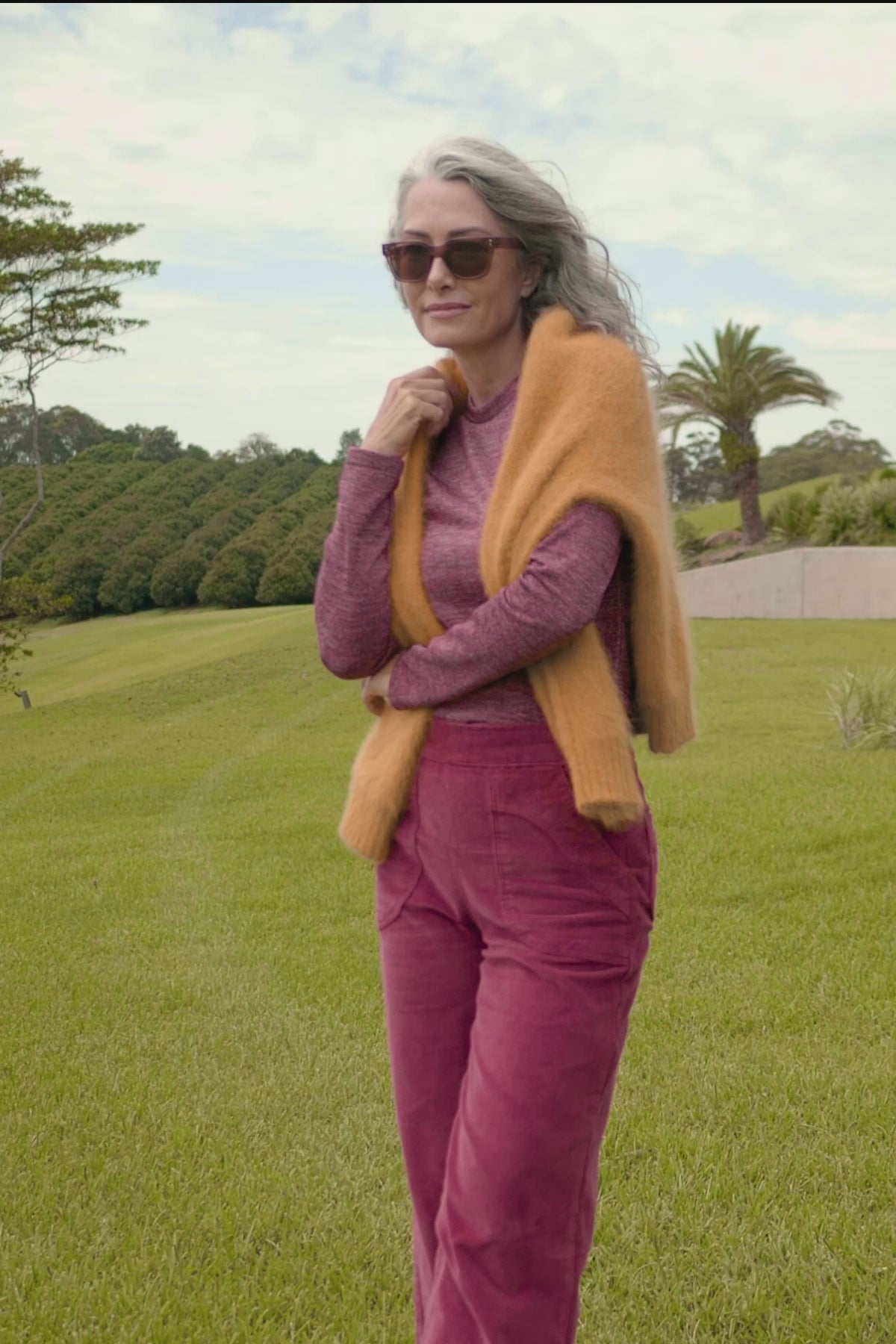 Olga de Polga dark pink colour lurex top with a sparkly sheen to it. Long sleeves and crew neckline. Front as seen on model