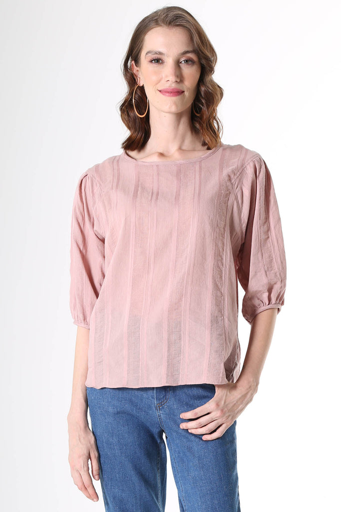 Olga de Polga Blouse in Avenida Textured cotton pink musk. the blouse features a beautifully detailed lantern sleeve with a drop shoulder and delicate pleating on the shoulder and cuff. It also has a wide boat neckline and invisible zip fastening at the back.