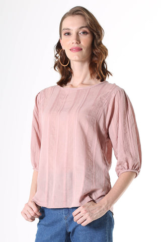 Olga de Polga Blouse in Avenida Textured cotton pink musk. the blouse features a beautifully detailed lantern sleeve with a drop shoulder and delicate pleating on the shoulder and cuff. It also has a wide boat neckline and invisible zip fastening at the back.