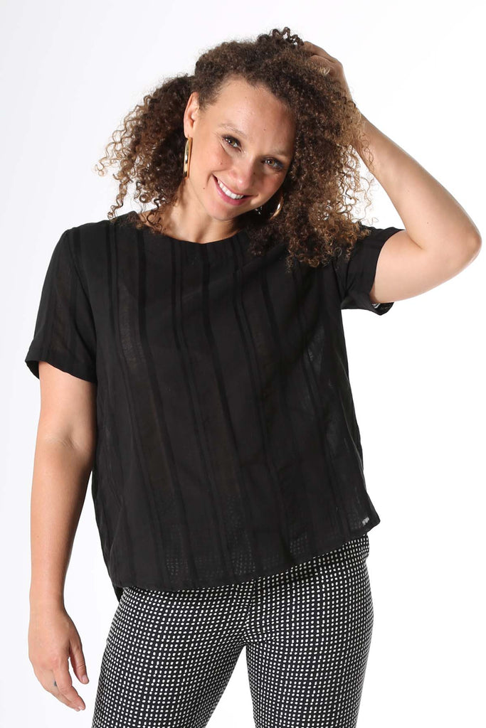 Woman wearing black cotton stripe top 