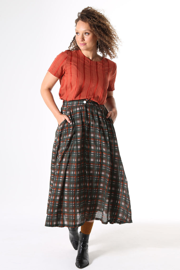 Olga de Polga top in Avenida textured cotton in Terracotta orange colour. Top is straight cut, with a short sleeve, crew neck and a box pleat at the back to give it more fullness and movement. 