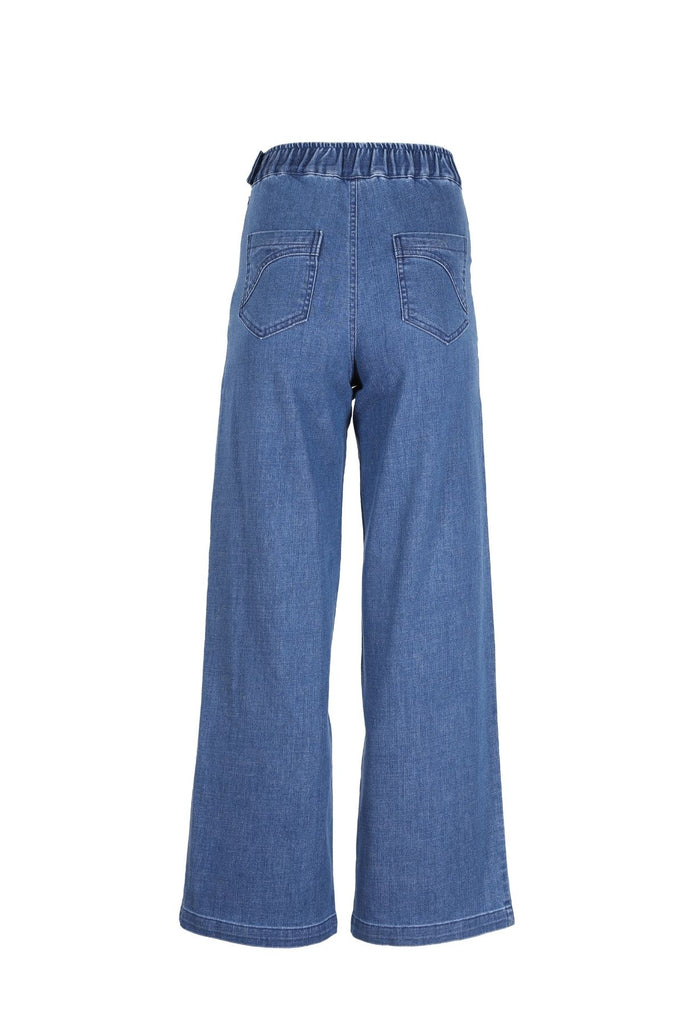 The Peggy Jeans have a cult-like following and are our most loved and most popular item of all time. We have recreated them in a new, full length to cover the ankle. A chic, ultra-comfortable take on your classic blue jeans, in a soft, stretchy denim, with a high waist, wide leg and oversized front pockets.  Back view.