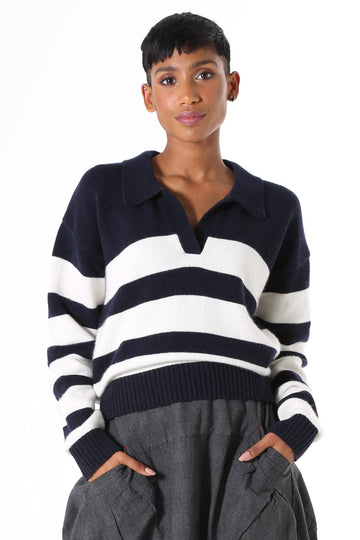 Olga de Polga knitwear. Seoul short sweater in navy and white stripes. Cropped length, relaxed fit, with an open collar, v-neck and dropped shoulder.  Front view on model