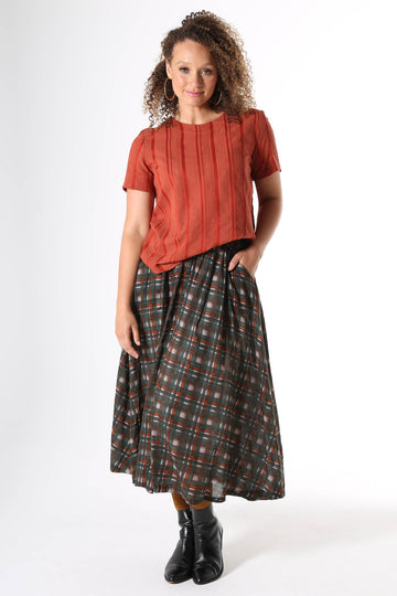 Olga de Polga cotton midi skirt with brown and green printed plaid pattern.