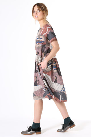 Olga de Polga Festival Drop Waist Dress Pink. The Drop Waist Dress is ideal for all seasons. Wear it with a cardi and boots in winter or pretty sandals in summer. Loosely cut in a relaxed fit that floats over the body, the dress features a slightly dropped waist with a pleated skirt to the knee, short sleeves crafted to sit loosely, a wide neckline and pockets!