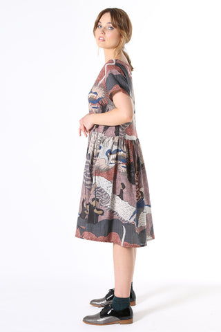 Olga de Polga Festival Drop Waist Dress Pink. The Drop Waist Dress is ideal for all seasons. Wear it with a cardi and boots in winter or pretty sandals in summer. Loosely cut in a relaxed fit that floats over the body, the dress features a slightly dropped waist with a pleated skirt to the knee, short sleeves crafted to sit loosely, a wide neckline and pockets!