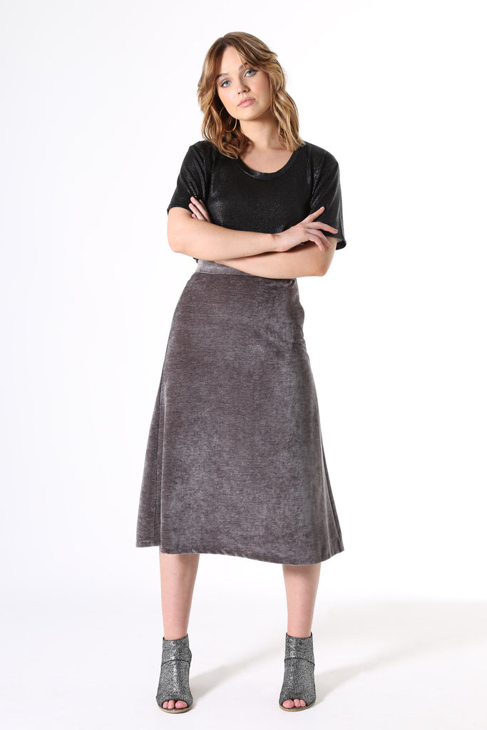 Olga de Polga Florence skirt in Ash grey velvet. Simple yet glamorous fully lined a-line skirt in luxe velvet, with an invisible side zip, elasticated waistband at the back and elegant below knee length.