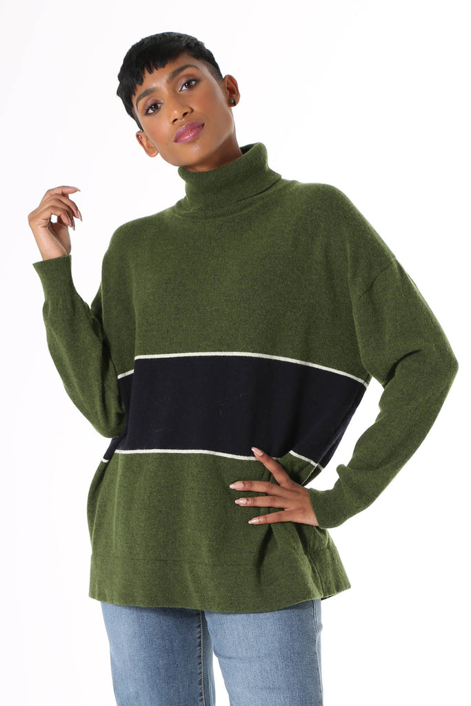 Olga de Polga Mariana Turtleneck sweater Green. Oversized long length boyfriend style knit, with rolled turtleneck and dropped shoulder. Fine light-weight wool viscose. Featuring a wide stripe with a fine white border. 