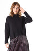 Olga de Polga Copenhagen knit sweater in black with long sleeves and a crew neckline. Front worn by model