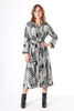 Olga de Polga Metro printed black and white shirt dress. Classic midi-length, shirt dress with slightly dropped shoulder, buttons all the way through from collar to hem, wide wrist length cuffs, a-line skirt and an elegant waist tie.