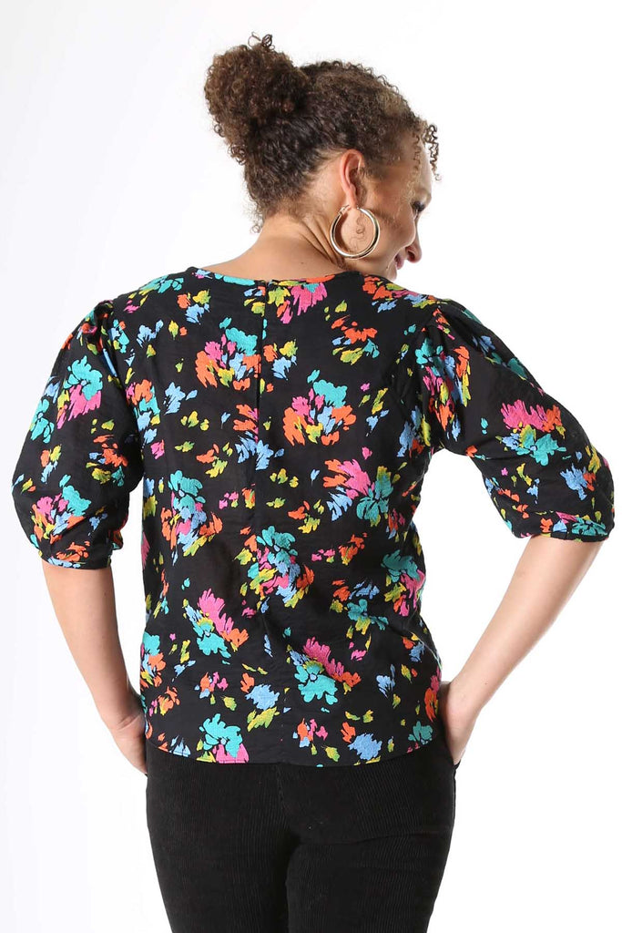 Olga de Polga Paradise printed blouse. Deep black with splashes of neon pink, orange, yellow and aqua. Soft, light-weight cotton/rayon fabric with a floaty drape. 