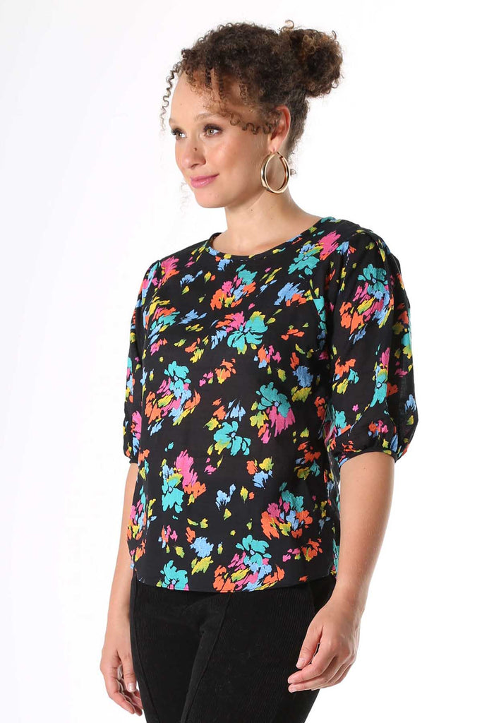 Olga de Polga Paradise printed blouse. Deep black with splashes of neon pink, orange, yellow and aqua. Soft, light-weight cotton/rayon fabric with a floaty drape. 