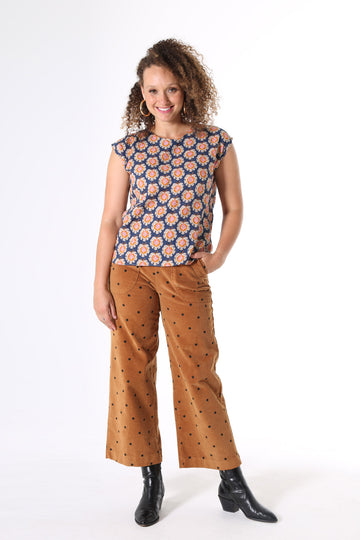 Olga de Polga Peggy Cord Caramel spot, Featuring detailed pockets, high waist and wide-leg cut, the Peggy Cords are a cropped ankle style designed to show off your favourite boots and shoes. The cord gives the style a more textured look with a heavier drape. They are super comfortable with moderate stretch and an elasticised back waist.