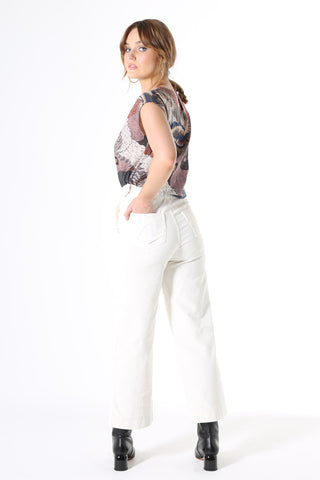 Olga de Polga Ivory White Peggy Jeans in a beautiful new fine cord. Featuring the same detailed pockets, high waist and wide-leg cut, the Peggy Cords are a cropped ankle style designed to show off your favourite boots and shoes.  Fine cotton stretch cord with a velvet quality.