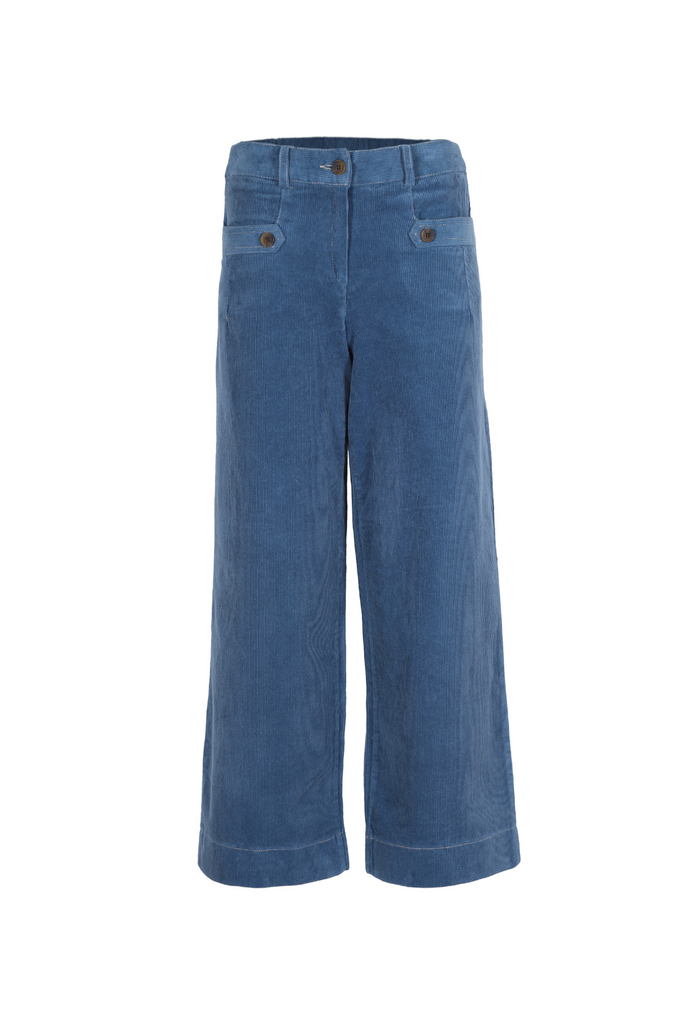 Olga de Polga pants. The new Lilian pants in blue cord fabric. Front zip opening and pocket detailing. Front view.