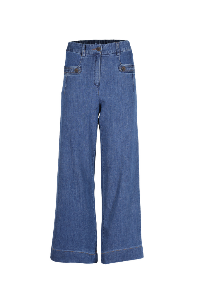 A new variation on the most loved and most popular Olga de Polga item of all time - Lillian.  Featuring beautiful button detailing on the pockets to elevate the texture of this style. Original wash classic 70's inspired indigo denim in 97% cotton with 3% spandex for stretch comfort. Front view.