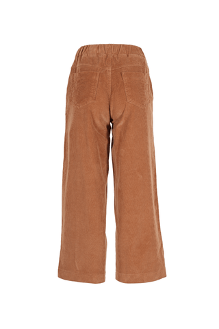 Our Betsy style features unique button detailing on the side to give our classic Peggy cords a twist.  The cord gives the style a more tactile appearance and adds an architectural element with the texture and heavier drape. Super comfortable with moderate stretch and an elasticised back.  Elastic high waistband at the back, flat front and wide-leg cut. Back view.
