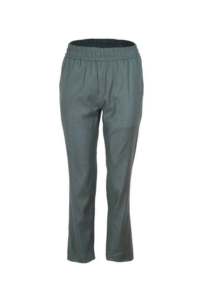 Hampton trousers in Green. These pants are high waisted, with a straight fit around the waist and thighs that then tapers to the ankle. The elasticated waistband also includes a hidden drawstring so you can loosen and tighten the pants as you desire. Front view.