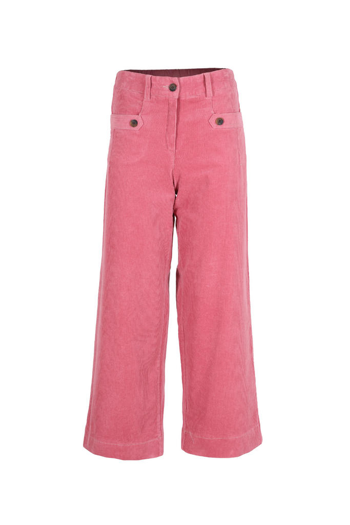 Olga de Polga pants. The new Lilian pants in pink cord fabric. Front zip opening and pocket detailing. Front view