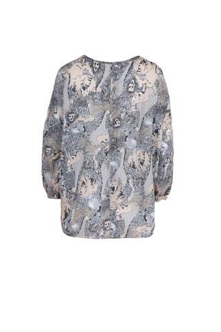 Olga de Polga Suzanna top. With its oversized, beautifully draped cut, our classic Suzanna Tops are both stylish and effortless. The Suzanna features dropped sleeves that are slightly gathered with a buttoned cuff. The back also has button detailing down the centre. This roomy box-cut design is perfect for leaving loose over jeans or tucking into a skirt. back view