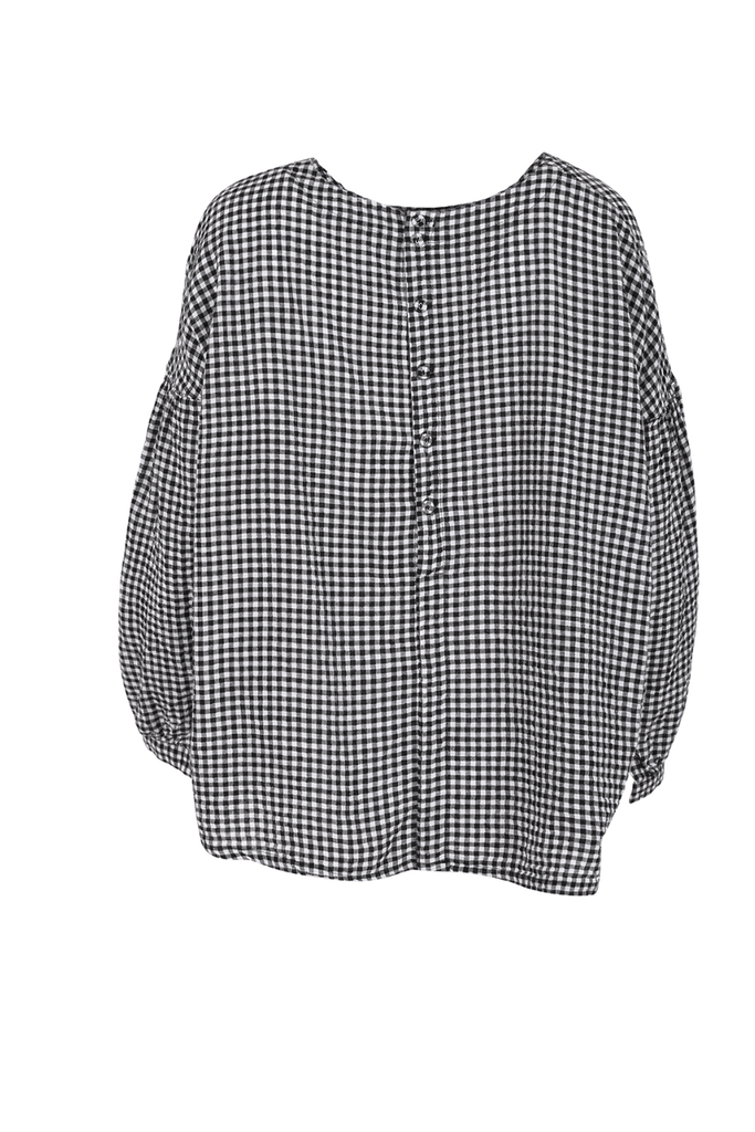 Olga de Polga classic Suzanna blouse in black and white gingham. Dropped shoulders, long sleeves and buttoned cuffs. Button detail down the back of the top. Back view